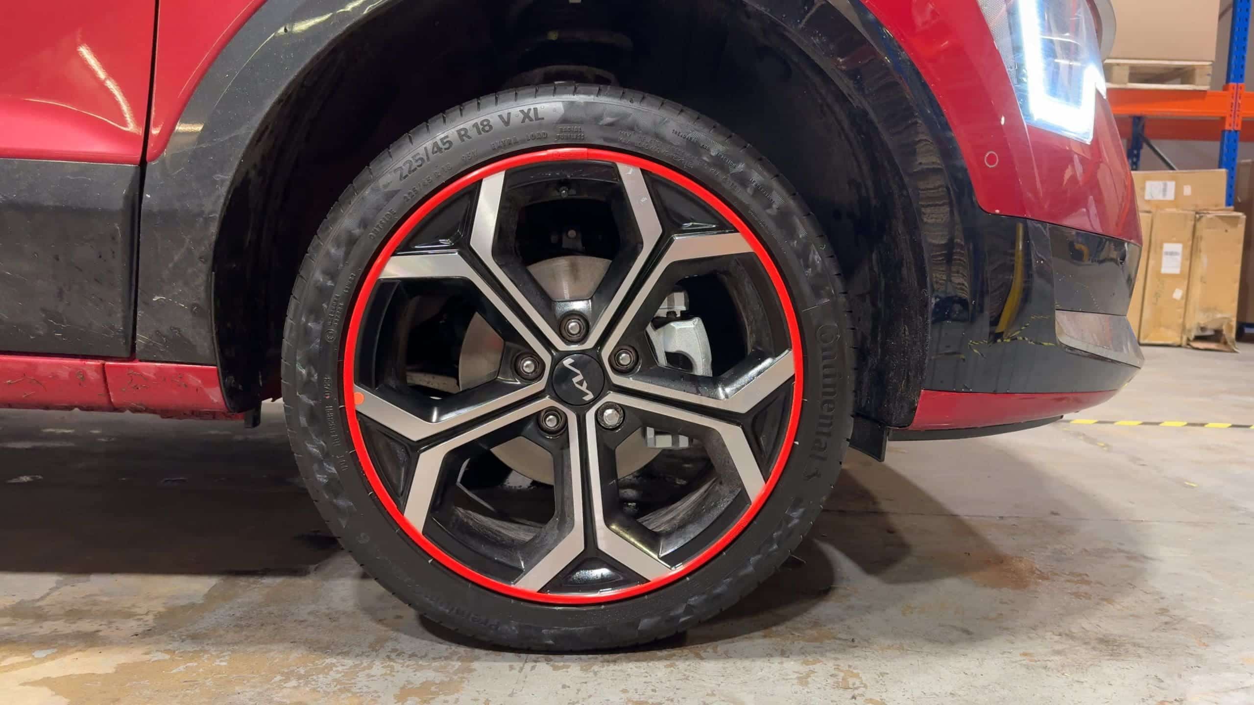 AlloyGator rim protectors installed on luxury car wheels, showcasing curb damage prevention and style enhancement